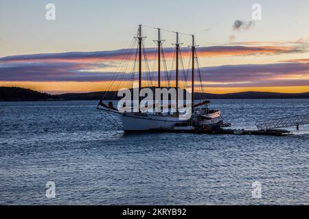 BAR HARBOR, MAINE, USA - OCTOBER 14, 2016: Bar Harbor morning view and docking Margaret Todd boat  with sunrise and clouds early morning Stock Photo