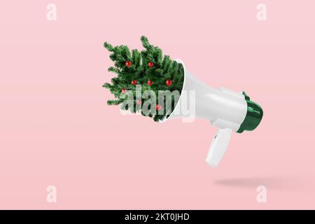 Creative composition made of megaphone with Christmas trees on pink background. Minimal Christmas or New Year concept. Stock Photo
