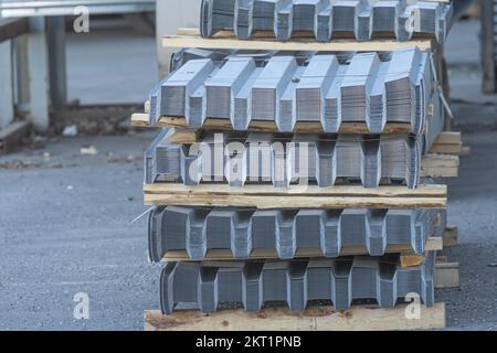 Pile of Metal roofing sheets to be picked up Stock Photo