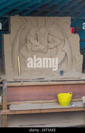 dragon sand sculpture, part of 70 Glorious Years sand sculpture for the Queens Platinum Jubilee on the beach at Weymouth, Dorset UK in October Stock Photo