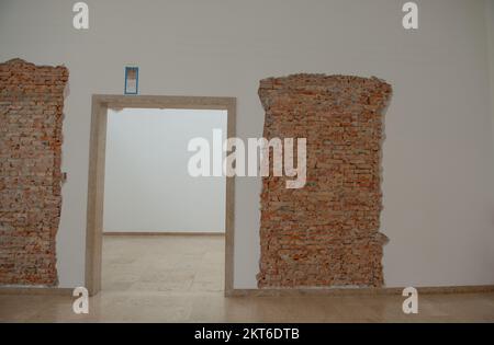 Plaster with exposed brick during the renovation Stock Photo