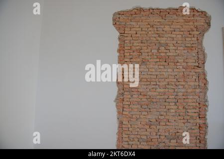 Plaster with exposed brick during the renovation Stock Photo