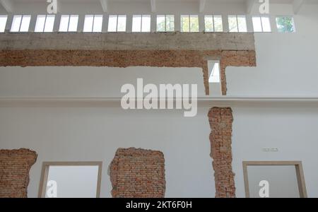 Plaster with exposed brick during the renovation Stock Photo