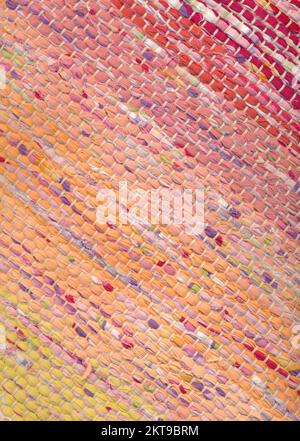 Closeup of colorful and bright handwoven rug rug with carpet lashes Stock Photo