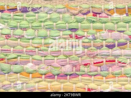 Closeup of colorful and bright handwoven rug rug with carpet lashes Stock Photo
