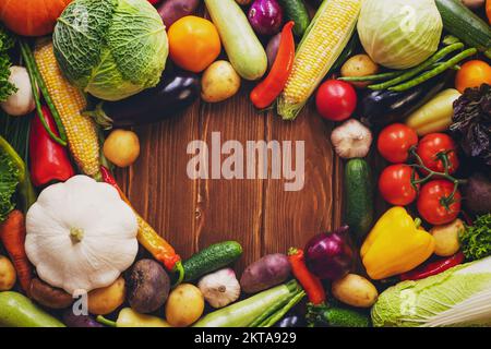 Healthy food background Assortment of fresh vegetables on wooden background Stock Photo