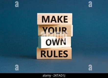 Make your own rules symbol. Concept words Make your own rules on wooden cubes. Beautiful grey table grey background. Business motivational make your o Stock Photo