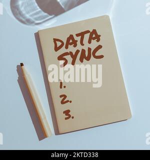 Writing displaying text Data Sync, Internet Concept data that is continuously generated by different sources Stock Photo