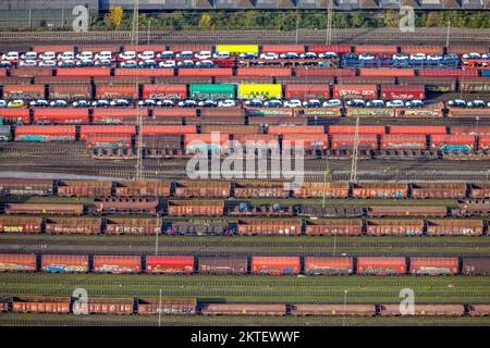 Aerial view, freight cars loaded with passenger cars, at Herne Wanne-Eickel main station, shapes and colors, Wanne, Herne, Ruhr area, North Rhine-West Stock Photo