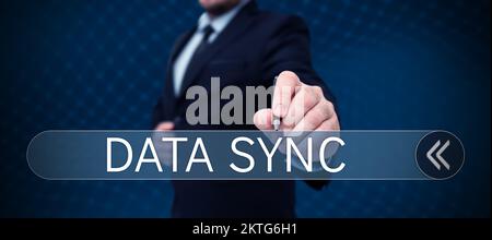 Writing displaying text Data Sync, Word Written on data that is continuously generated by different sources Stock Photo