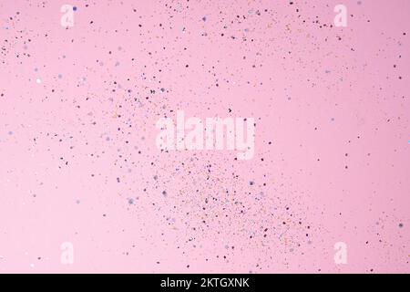 Sequins on pastel pink background. Festive concept. High quality photo. A great background for a holiday card, wedding or birthday invitation or advertisement. Copy Space Stock Photo
