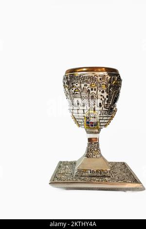 Shabbath kiddush cup. Top view image of jewish wine cup for wine. passover holiday and shabbat concept. Silver goblet isolated on a white background, Stock Photo