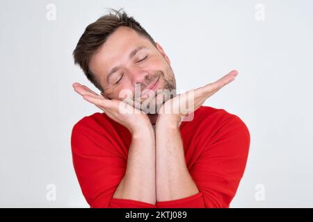 Confident young man looking away dreaming. Funny guy hinking about the future.  Stock Photo