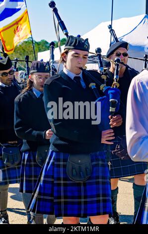 Scottish pipers play the bagpipes as they march in the parade of tartans during the annual Celtic Music Festival in Gulfport, Mississippi. Stock Photo