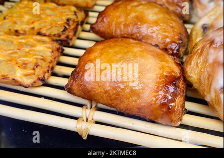 French bakery, fresh baked sweet buns and rolls on display in small French bakery in Paris, France Stock Photo