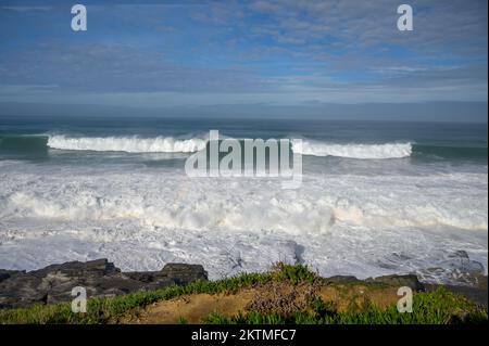 Magoito Beach on Atlantic ocean during storm and high waves, beautiful sandy beach on Sintra coast, Lisbon district, Portugal, part of Sintra-Cascais Stock Photo