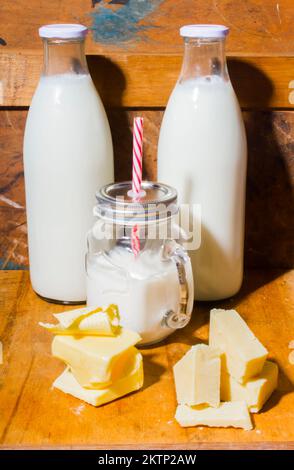 A old fashioned scene from the days of the milkbar with milk butter and cheese. Dairy delights Stock Photo