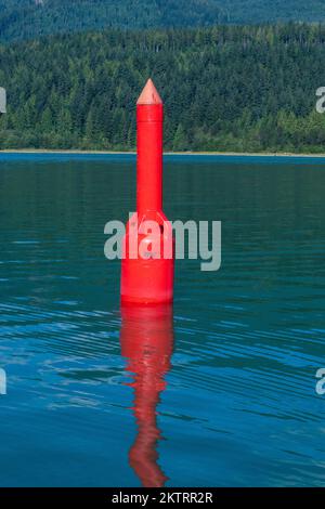 Red port navigation buoy on Stave Lake in Mission, British Columbia, Canada Stock Photo