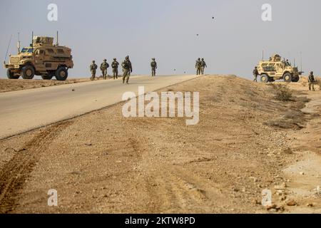 Al Asad Air Base, Iraq. 18th Nov, 2022. U.S. Army Soldiers assigned to Charlie Company, 2nd Battalion, 22nd infantry regiment, 1st Brigade Combat Team, 10th Mountain Division, conduct a dismounted patrol, at Al Asad Air Base, Iraq, November. 18, 2022.Patrols of the amber zone are conducted in order to identify possible threats to the area of operation. In coordination with partner Iraq Security Forces to advise assist and enable them in the enduring defeat of ISIS. Credit: U.S. Army/ZUMA Press Wire Service/ZUMAPRESS.com/Alamy Live News Stock Photo