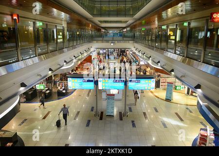 DUBAI, UAE - APRIL 18, 2014: airport interior. Dubai International Airport is a major international airport located in Dubai, and is the world's busie Stock Photo