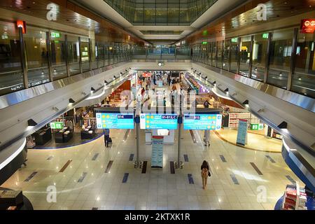 DUBAI, UAE - APRIL 18, 2014: airport interior. Dubai International Airport is a major international airport located in Dubai, and is the world's busie Stock Photo