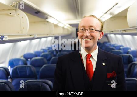 NEW-YORK, USA - APRIL 19, 2011: Delta Air Lines crew member in Boeing 757. Delta Air Lines, Inc. is a major American airline, with its headquarters an Stock Photo