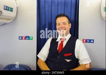 NEW-YORK, USA - APRIL 19, 2011: Delta Air Lines crew member in Boeing 757. Delta Air Lines, Inc. is a major American airline, with its headquarters an Stock Photo