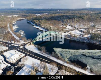 Merrimack River and Tyngsborough Bridge aerial view in winter in town center of Tyngsborough, Massachusetts MA, USA. Stock Photo