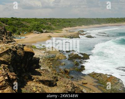 Bundala National Park is a Ramsar Site where many migratory birds and native birds live. It provides different wetland ecosystems for floral and faunal species. Prosophis, Giant Opuntia and Hambu pan; invasive species spread over the wetland. The water in the beach and the rocky offshore is crystal clear. Coastal fishing takes place here. Bundala, Sri Lanka. Stock Photo