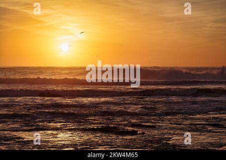 Waves at sunset on the Atlantic Ocean, backlight, Essaouira, Marrakech-Safi, Morocco, Africa Stock Photo