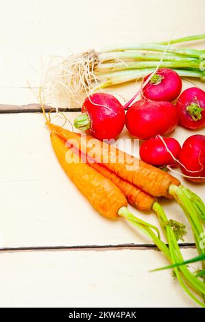 Raw root vegetable on a rustic white wood table Stock Photo