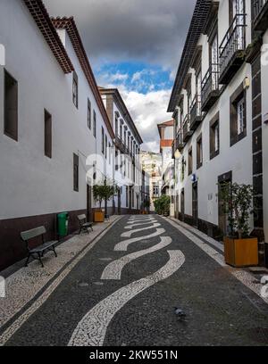 Small alley with mosaic floor in the old town, Funchal, Madeira, Portugal, Europe Stock Photo