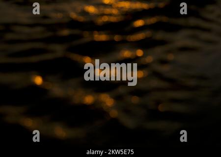 Shining bokeh light isolated on black background. Stock Photo