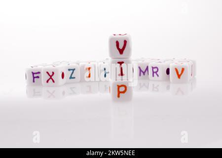 Alphabet blocks and the word VIP on a white background Stock Photo - Alamy