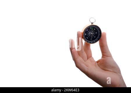 Isolated compass in child's hand on a white background Stock Photo