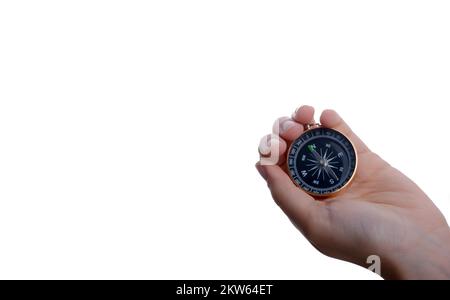 Isolated compass in child's hand on a white background Stock Photo