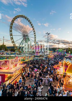 Ferris wheel, chain carousel and other rides and stalls at the Cannstatter Volksfest, Cannstatter Wasen, Bad Cannstatt, Stuttgart, Baden-Württemberg, Stock Photo