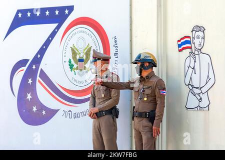 Chiang Mai, Thailand, 29/11/2022, Thai police officers stand on guard during the demonstration, at U.S. Consulate General Chiang Mai. The 'Citizens Stop Apec 2022 Coalition' demanded that the U.S. government as 1 of 21 APEC Members to take responsibility for the human rights abuses, from the rallies that were violently dispersed on 18 November at the APEC 2022 summit in Bangkok by riot police where 25 people were arrested and at least 31 people were injured, including Mr. Phayu Boonsophon, a protester, was shot by rubber bullets and lost his right eye. Stock Photo