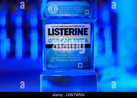 Tyumen, Russia-October 14, 2022: Listerine is a brand of antiseptic mouthwash product, blue background, selective focus Stock Photo