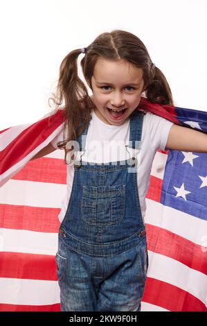 Happy little citizen of United States of America- lovely baby girl wrapping USA flag. Citizenships. Independence Day Stock Photo