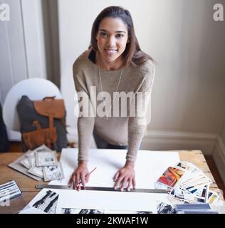 My hobby makes me happy. A young woman working on her portfolio at home. Stock Photo