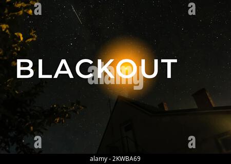 Blackout, power grid overloaded. Blackout concept. Earth hour. Burning flame candle and power lines on background. Energy crisis. Dark starry night. Stock Photo