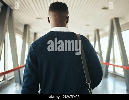 Travel for business at airport, corporate worker walking to plane with luggage. Ceo work trips journey, boarding terminal and back portrait of stylish Stock Photo