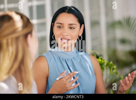 Manager, CEO or leader meeting with an employee and talking or discussing the vision, mission and plan for company growth and development. Teamwork Stock Photo