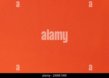 Unicolorous bright orange fabric as background. Stock Photo