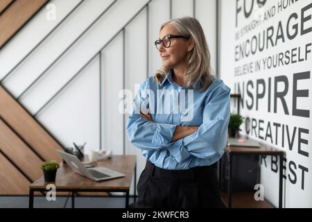 successful woman auditor in the office next to the table Stock Photo
