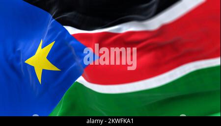 Close-up view of the South Sudan national flag waving in the wind. The Republic of South Sudan is a country in Central Africa. Fabric textured backgro Stock Photo