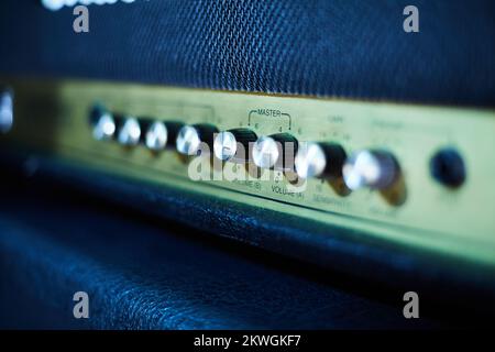 Guitar amplifier, level knobs closeup shot. Electric guitar amp closeup photo for rock music.  Stock Photo