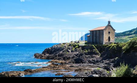 Hermitage called Santa Catalina, located in front of the sea, in Mundaka, Basque Country, Spain Stock Photo
