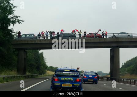 McRae Gathering of Subaru Imprezas. Anniversary of the death Colin McRae around 1200 cars headed for former RAF Honiley. Enthusiasts view over M40 Stock Photo
